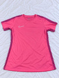 Pink and magenta short sleeve sports shirt shown from the front