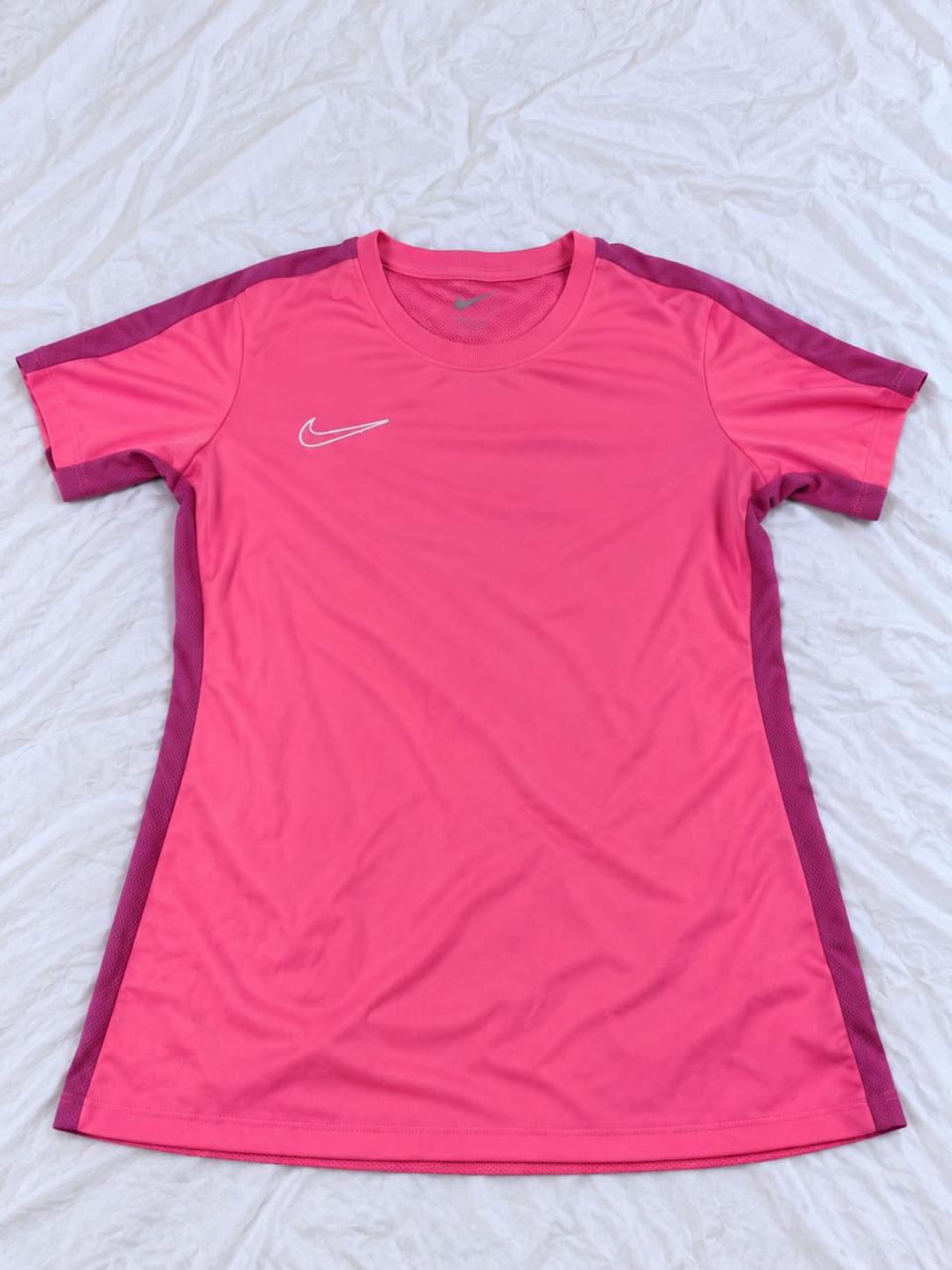 Pink and magenta short sleeve sports shirt shown from the front