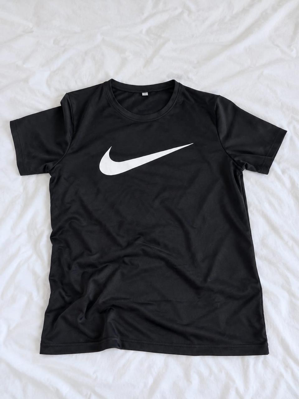Black and white short sleeve sports shirt shown from the front