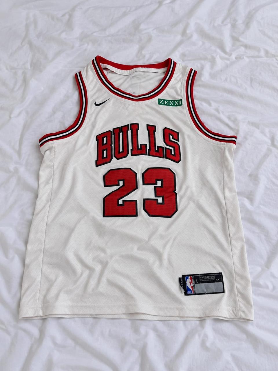 White, red, and black sleeveless sports jersey shown from the front