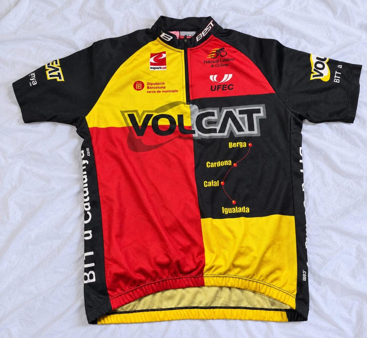 Red, yellow, and black short sleeve cycling jersey shown from the front