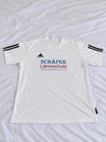 White, black, blue, and red short sleeve sports jersey shown from the front