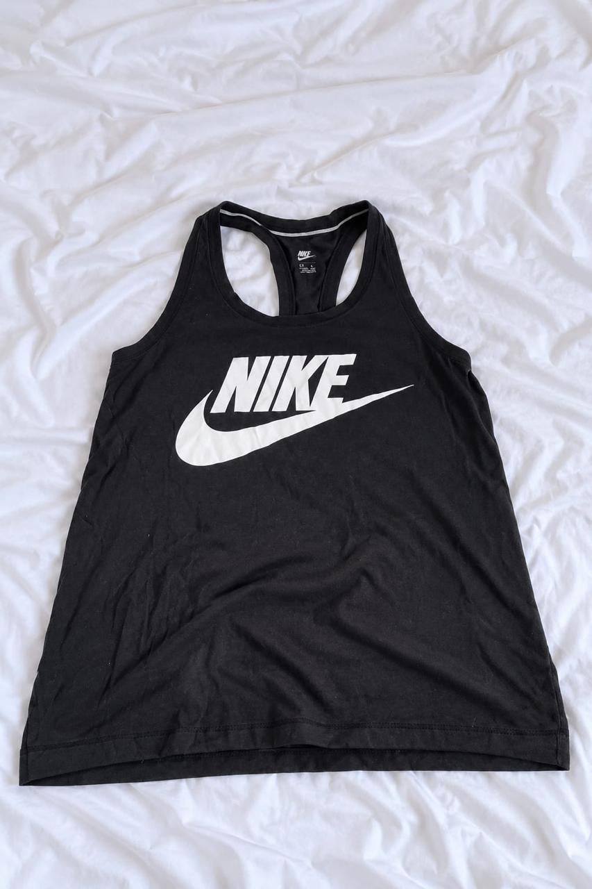 Black and white sleeveless sports top shown from the front