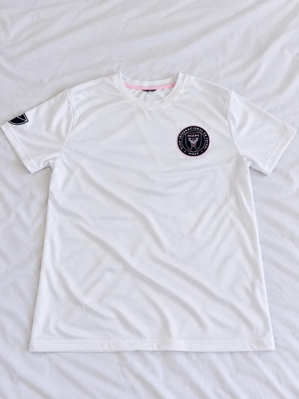 White, black, and pale pink short sleeve football jersey shown from the front