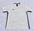 White and black short sleeve sports jersey shown from the front
